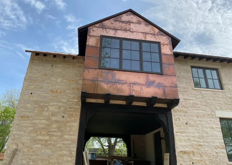 Copper metal panel facade on a stone building for Metal Roof Coating in Bull Run